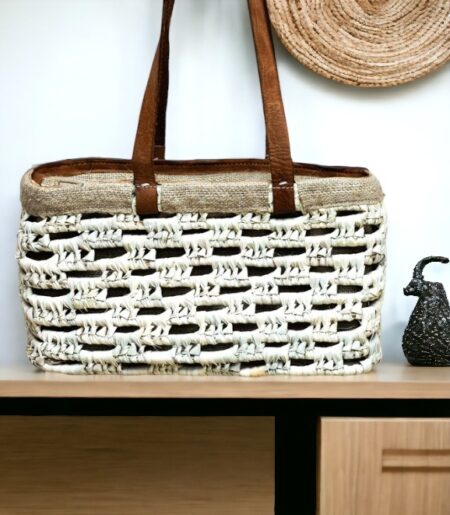 woven basket with brown leather handles